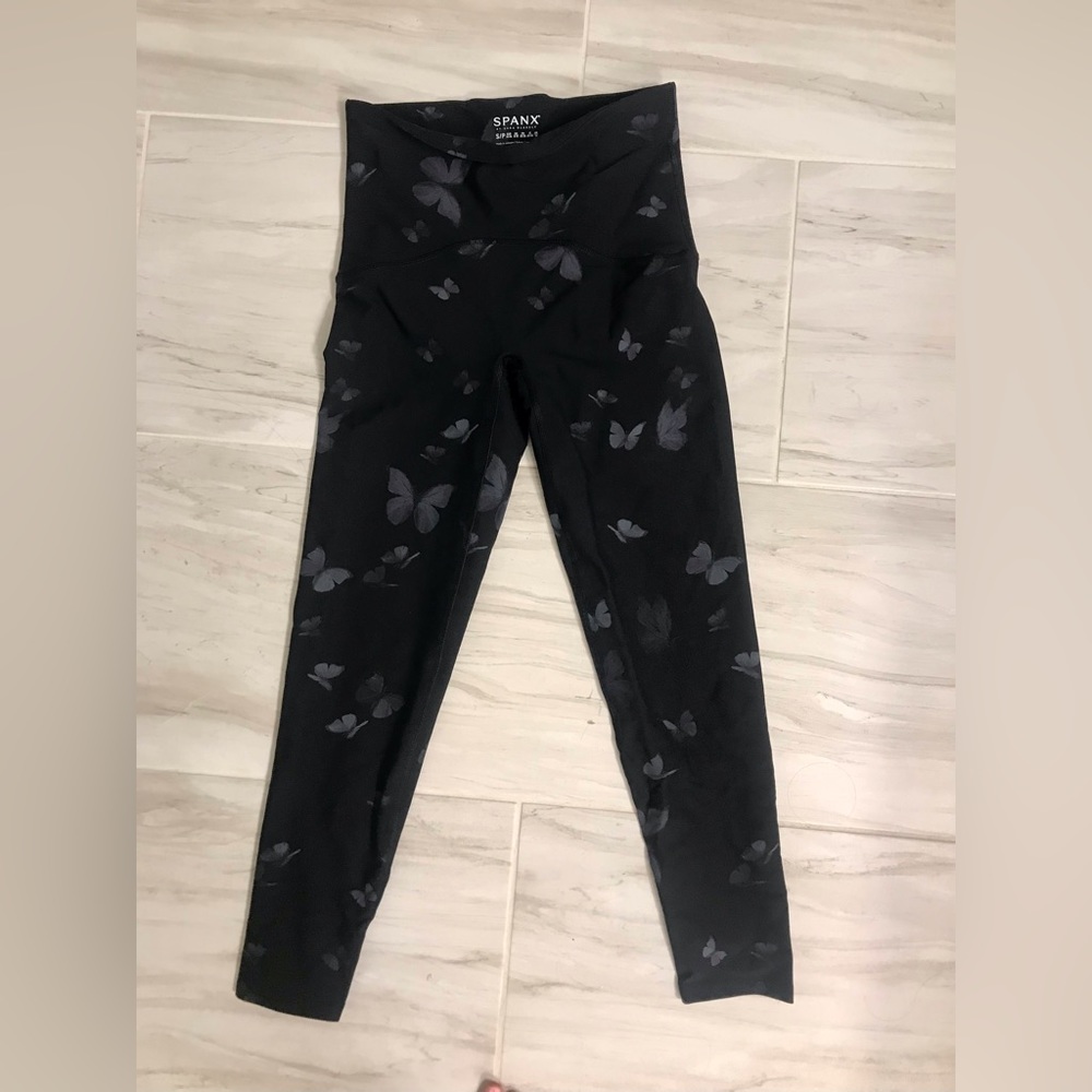 Spanx small leggings. Black with butterfly print. Never been worn!!!